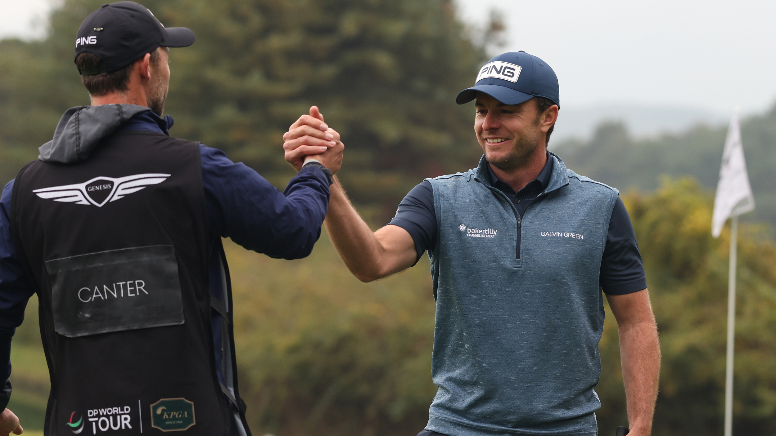 Laurie Canter and his caddie shake hands