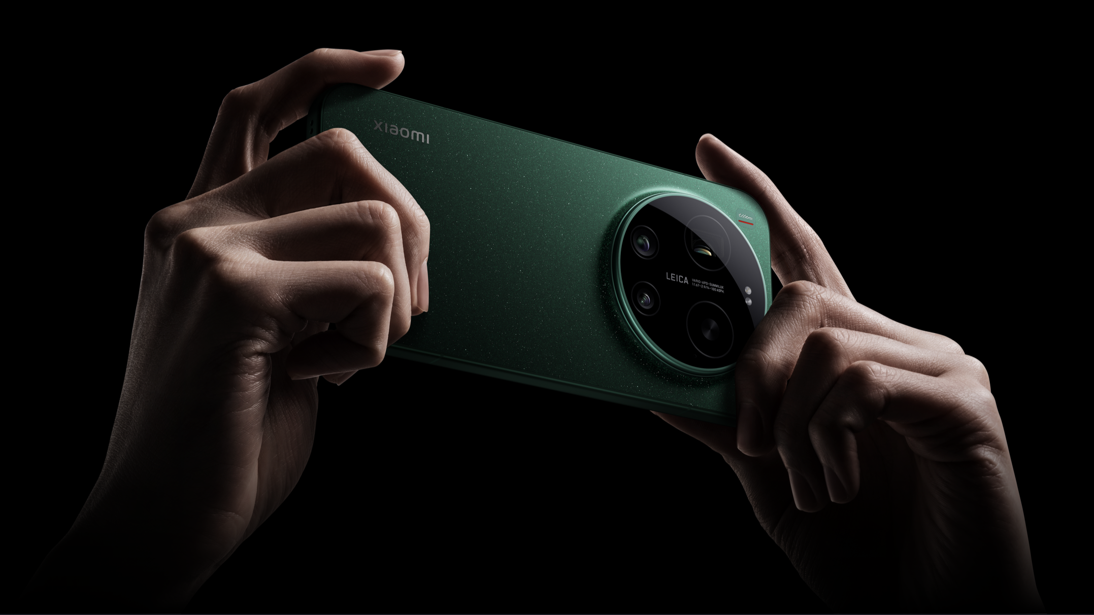 Xiaomi 17 Ultra phone held in a hand on black background