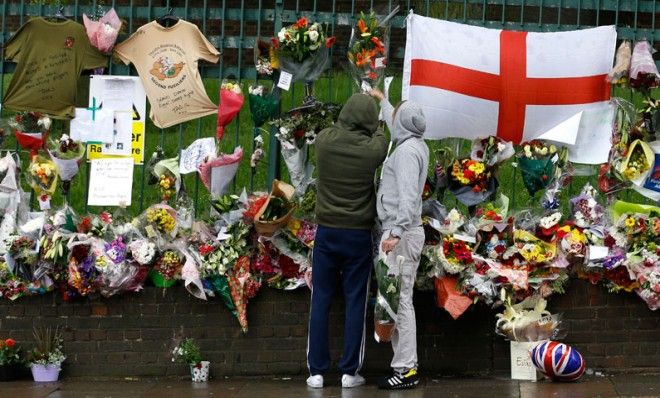 Well-wishers leave flowers where 25-year-old soldier Lee Rigby was killed in south London.