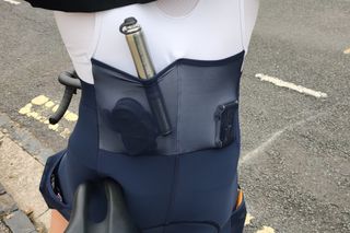 Image shows a rider wearing the Rapha Core Cargo Bib Shorts.