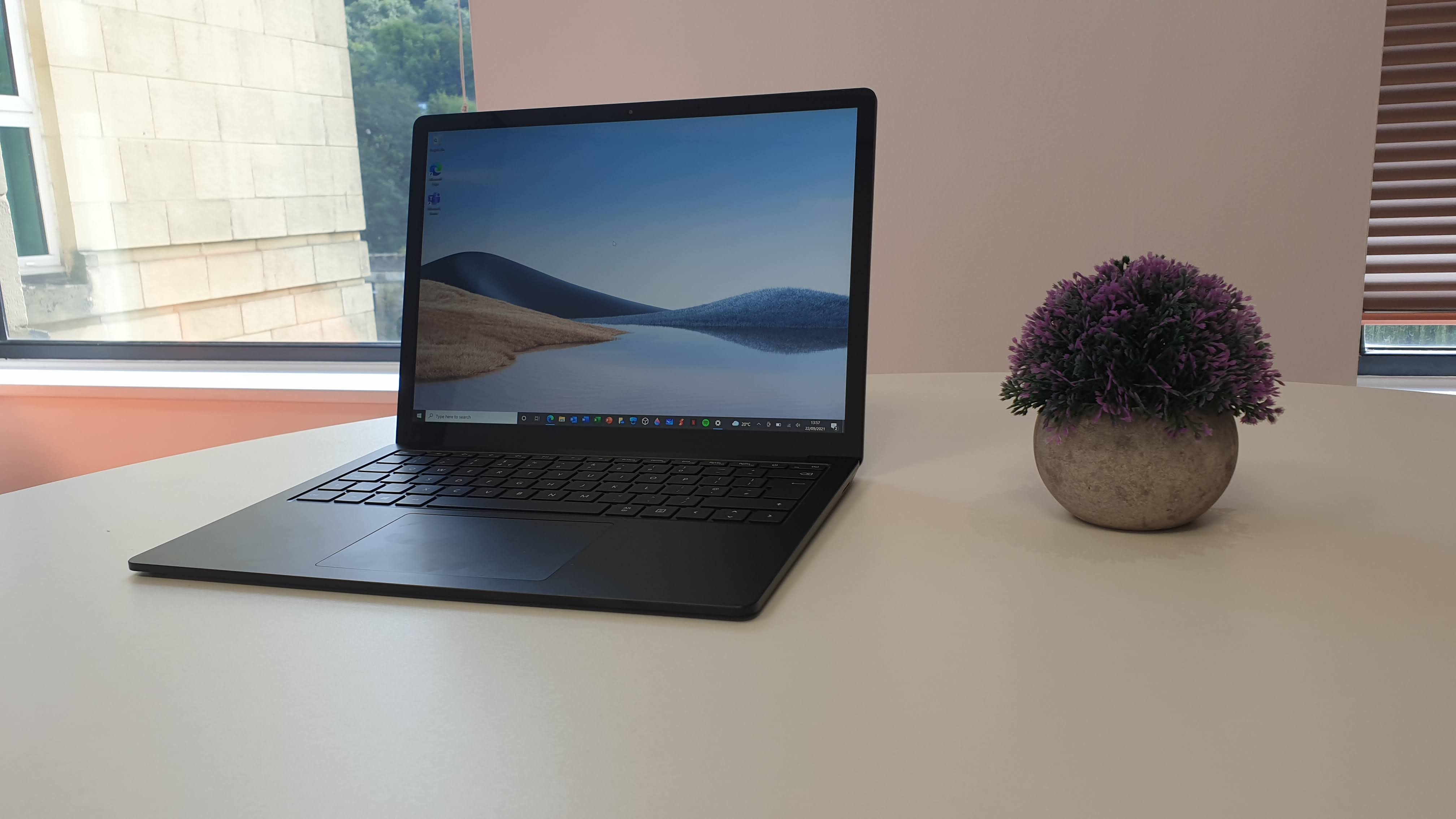 Surface Laptop 4 on a wooden table in an office
