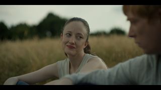 Andrea Riseborough as Alice, with Jack.