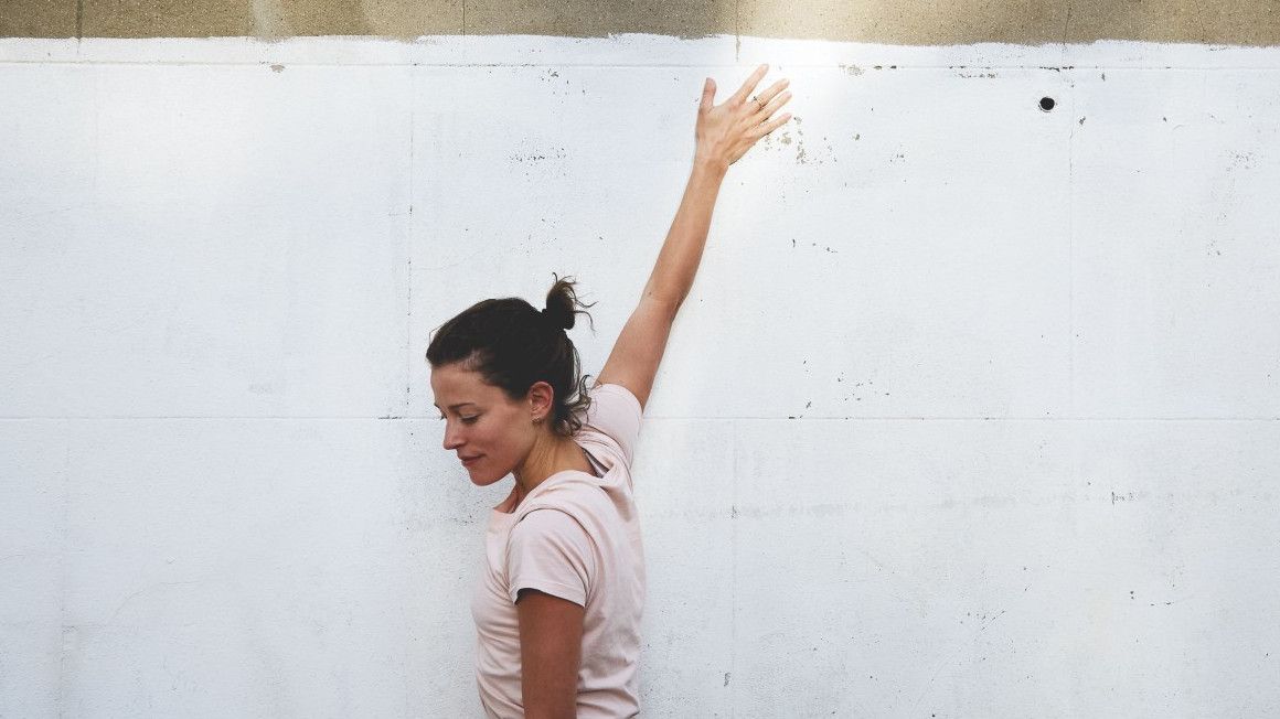 Naomi Annand demonstrating the clock shoulder stretch