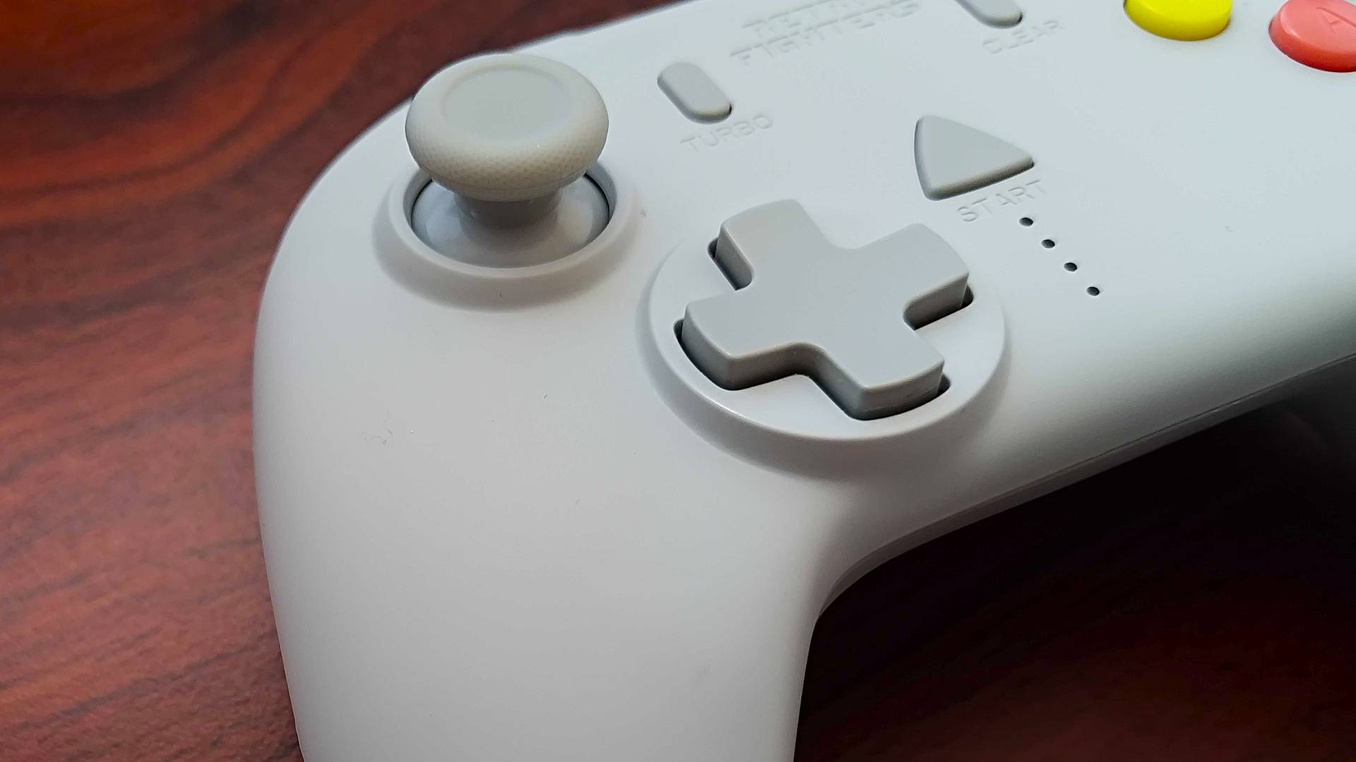 Close up of Retro Fighters StrikerDC controller d-pad and joystick.