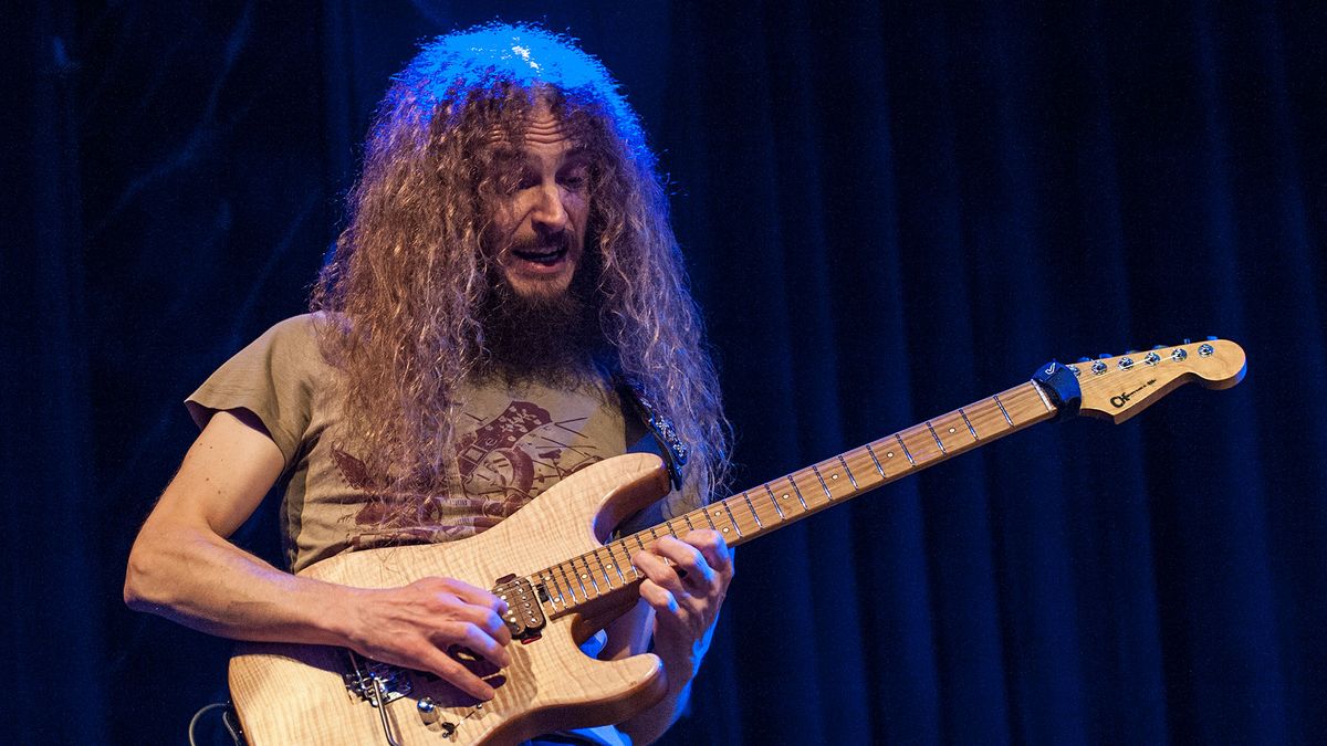 Guthrie Govan, onstage in 2014