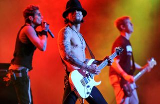 Dave Navarro performs live with an Ibanez guitar