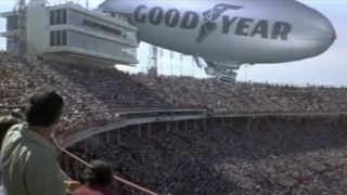 Goodyear blimp crashing into a stadium during the Super Bowl in Black Sunday