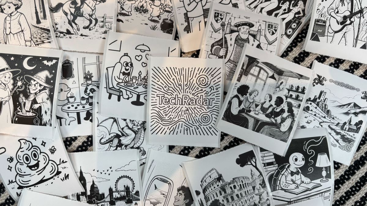 A bunch of stickers with different designs sprawled out on a blanket with a TechRadar one in the centre