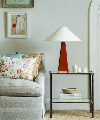 neutral living room with unexpected red lamp