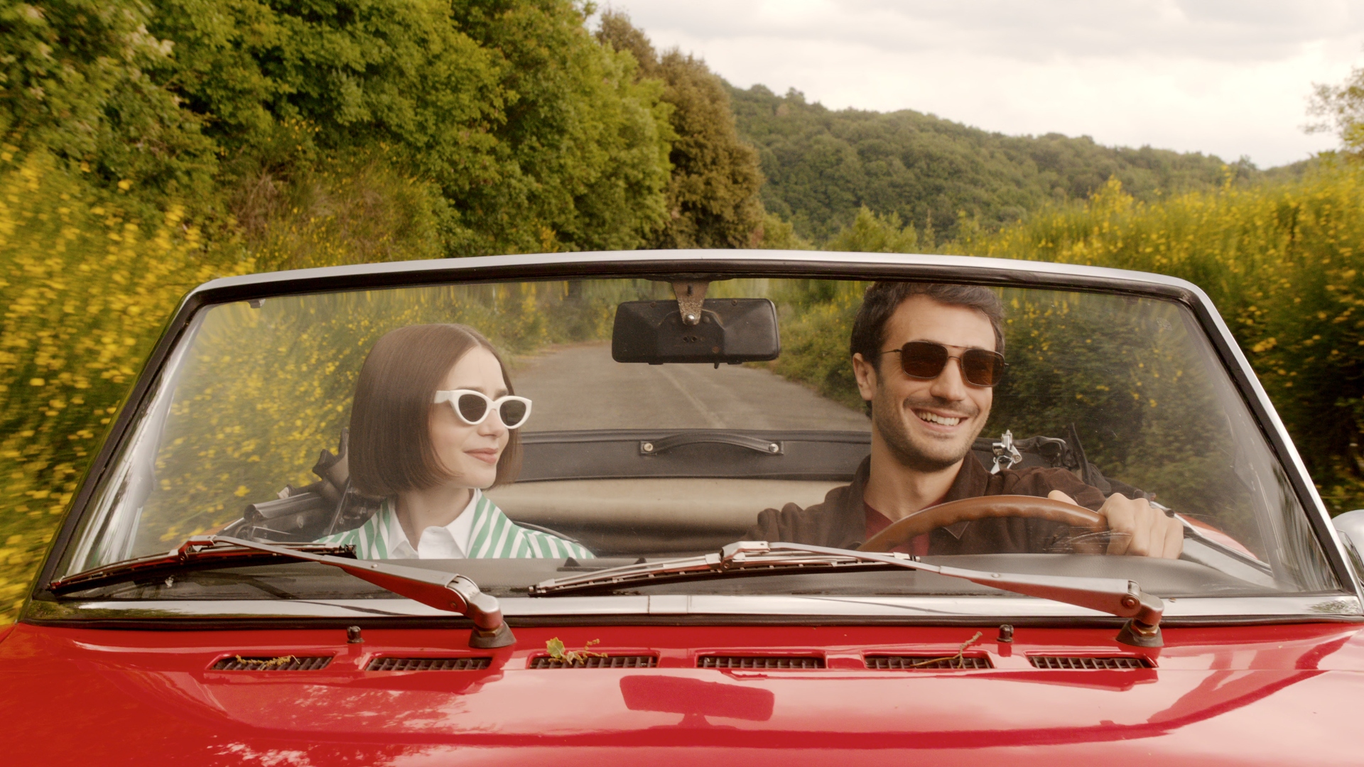 Emily and Marcello drive in a car in Emily in Paris season 5