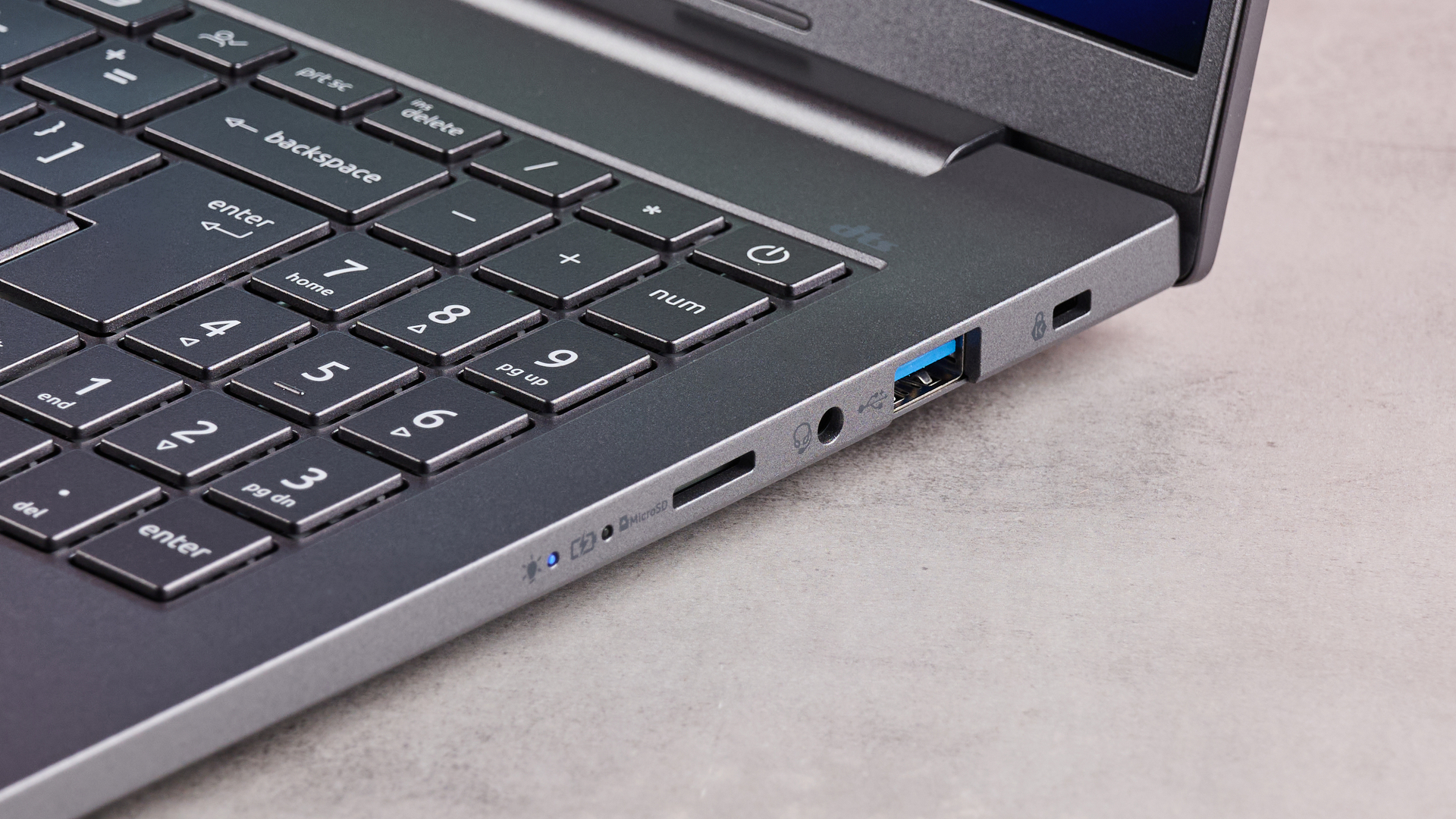 Close-up of right-hand ports on Acer Aspire 16 AI on table