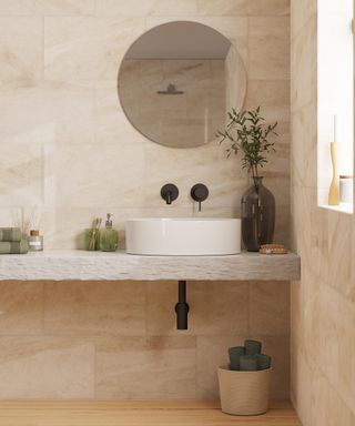 Beige bathroom with stone tiles by Dunelm