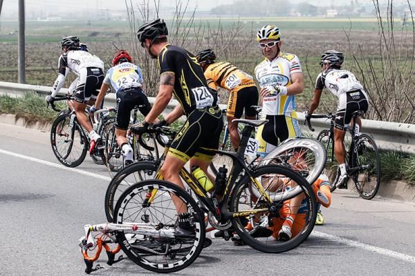 Riders pick themselves up from a crash during stage 2.