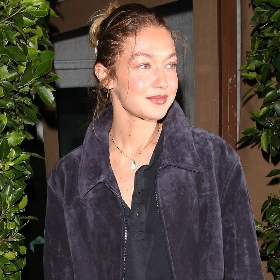 Gigi Hadid was spotted in L.A. wearing a suede jacket, a henley shirt, jeans, and brown loafers