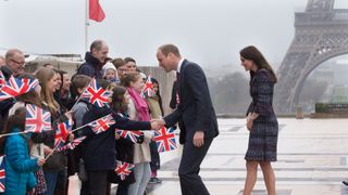 Prince William and Kate Middleton greet fans in Paris