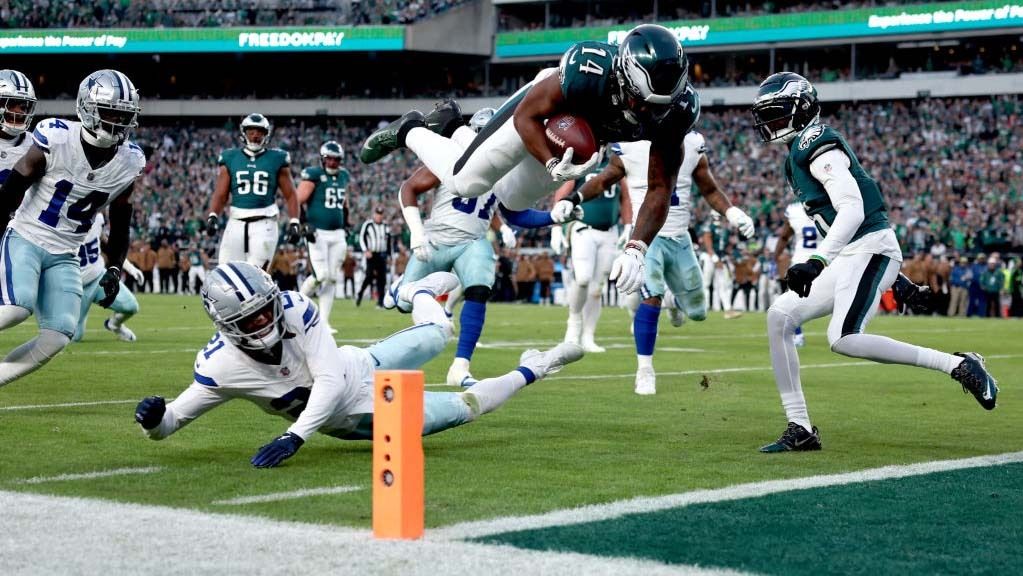 Kenneth Gainwell #14 of the Philadelphia Eagles dives for a touchdown during the first quarter in the game against the Dallas Cowboys at Lincoln Financial Field on November 05, 2023