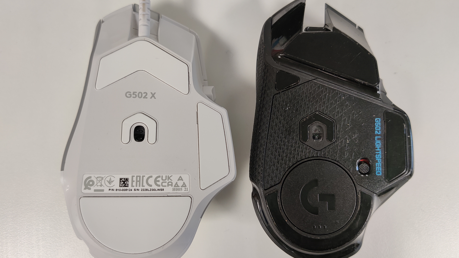 The Logitech G502 X top down next to the previous model.