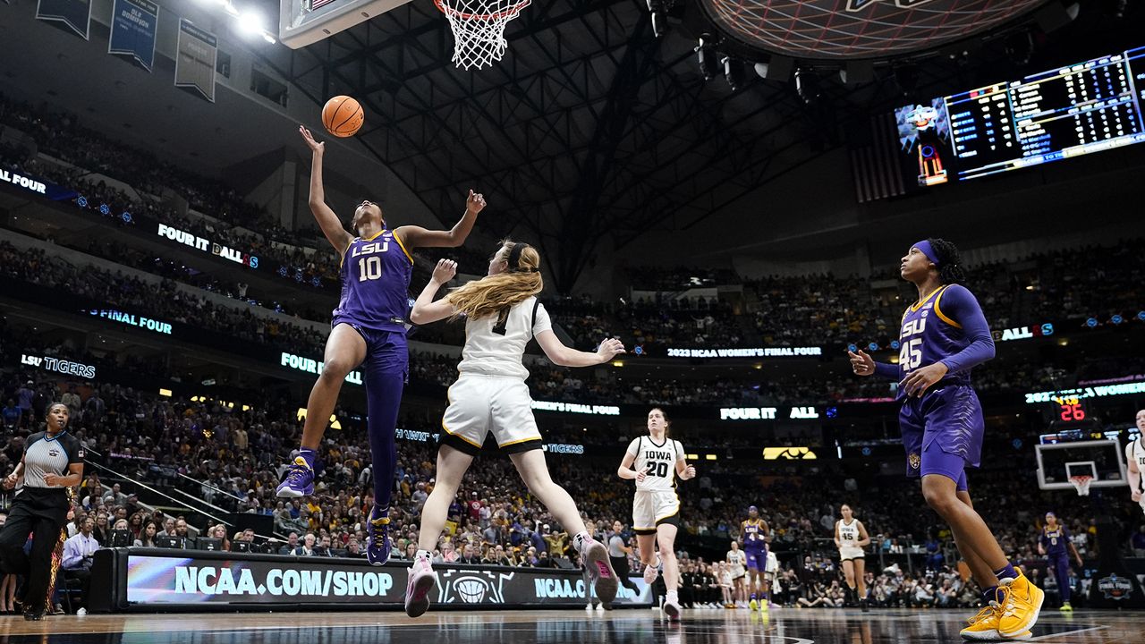 LSU&#039;s Angel Reese shoots past Iowa&#039;s Molly Davis during the second half of the NCAA Women&#039;s Final Four championship basketball game