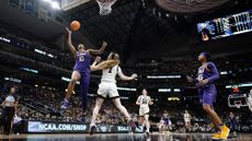 LSU's Angel Reese shoots past Iowa's Molly Davis during the second half of the NCAA Women's Final Four championship basketball game