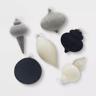 Flocked finial ornaments in white, grey, and black