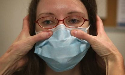 A doctor examines a Chicago-area patient experiencing flu-like symptoms on Jan. 10.