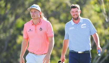 Smith and Leishman walk the fairway