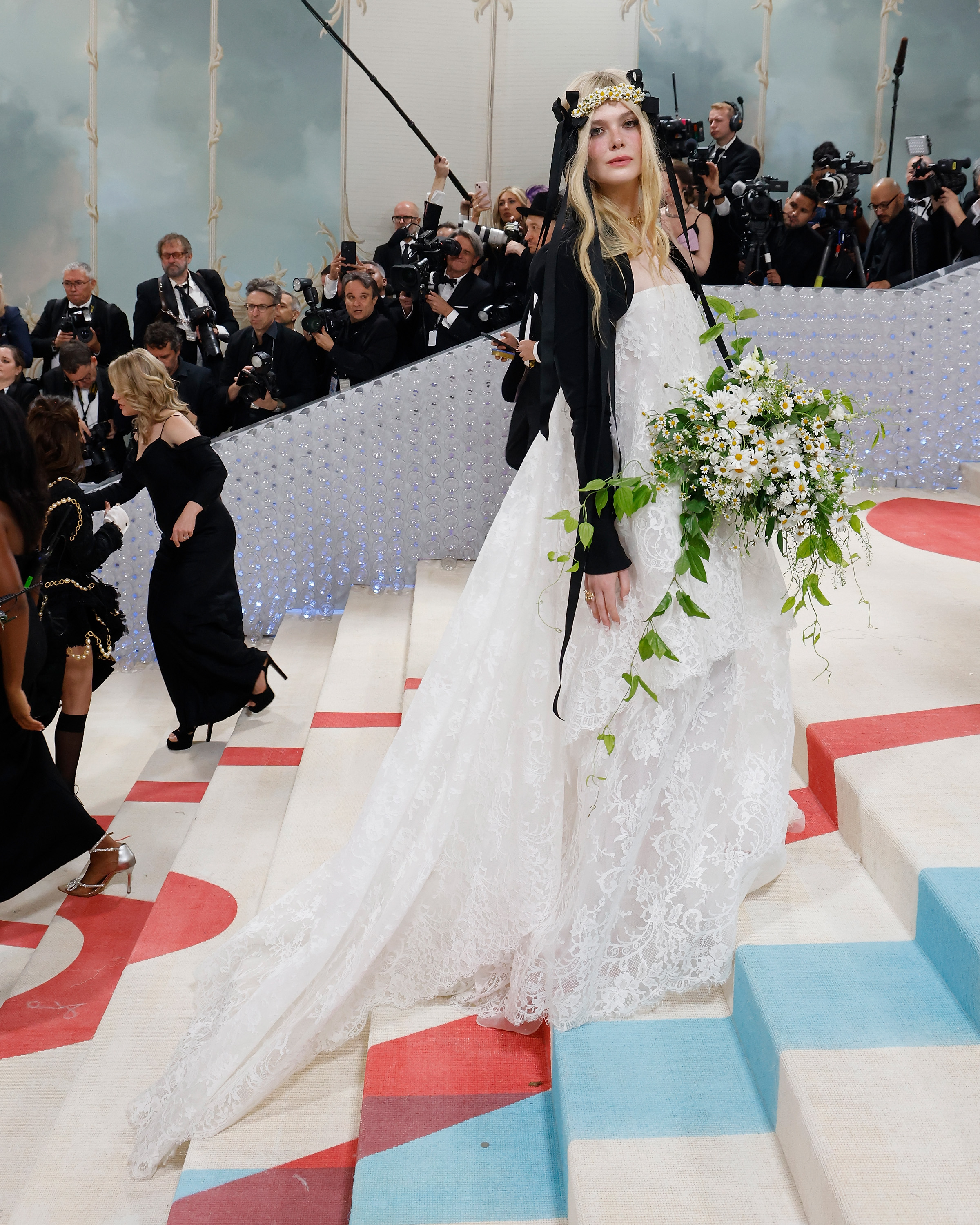Elle Fanning wearing a white Vivienne Westwood dress to the Met gala