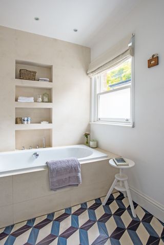 bathroom with patterned floor tiles photographed by polly eltes