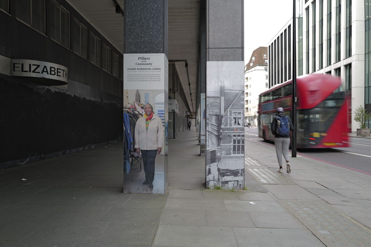 London street scene with blurred movement of passing red bus