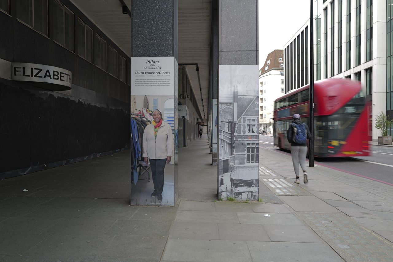 London street scene with blurred movement of passing red bus