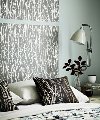 Grey bedroom with wallpaper headboard