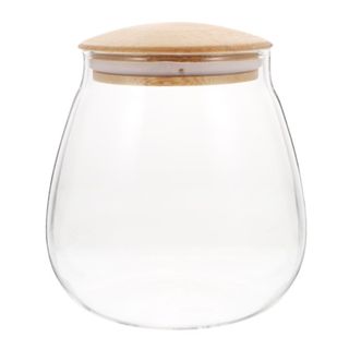 A glass jar with a wooden lid