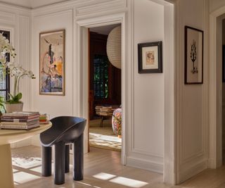 modern interior white hallway with black minimalist chair