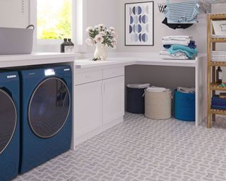 Laundry room with decorative floor tiles