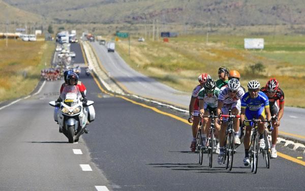 The early break cuts a lonely shape on the road.