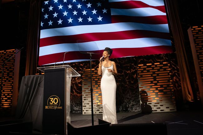 Tahira Clayton sings the national anthem at the 2022 B+C Hall of Fame