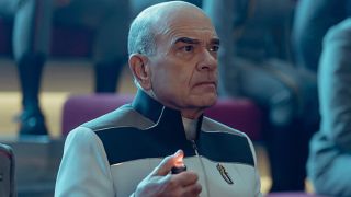 The Doctor holding a buzzer