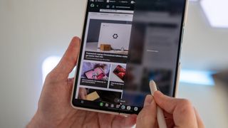 Using an S Pen on a Samsung Galaxy Z Fold 4 to multitask with the built-in taskbar