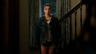 Claire (Sydney Sweeney) stands in wet clothes in a hallway in a scene from Apple TV Plus' "Echo Valley"