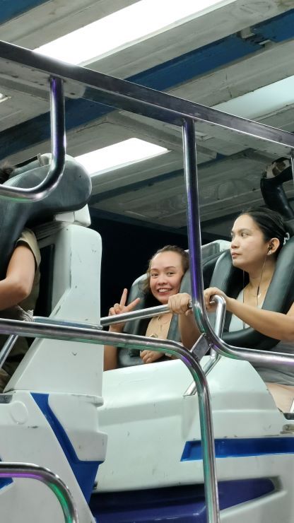 A thrilling roller coaster ride with a group of people enjoying the adrenaline rush