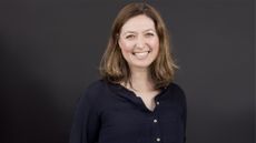 Alteryx Chief Marketing Officer (CMO) Michelle Huff pictured against a dark grey background.