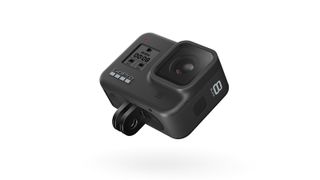 GoPro Hero 8 Black action camera photographed with its folding finger mounts extended