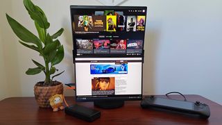 Jsaux FlipGo connected to Steam Deck on desk with GamesRadar+ home page and Steam Big Picture displayed
