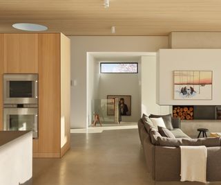 open plan living and kitchen with concrete floor