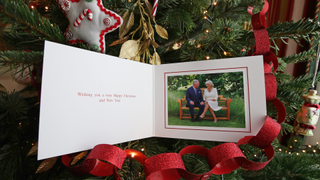 The 2018 Christmas card of the Prince of Wales and Duchess of Cornwall on a Christmas tree on December 11, 2018 in Clarence House, London. The card features a photograph of the royal couple, taken by Hugo Burnand in the gardens of Clarence House