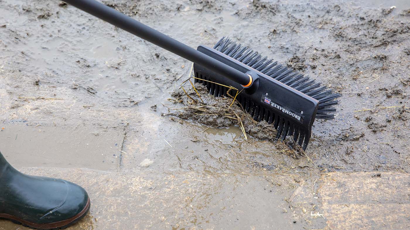 BroomRaker outdoor broom being used on a yard
