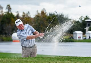 Mark O'Meara hits a bunker shot