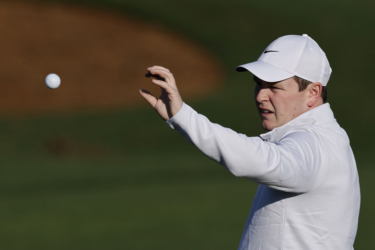 Robert MacIntyre catches a golf ball