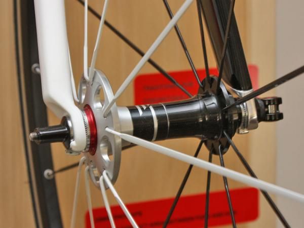 This side-by-side display (the conventional design is on the right) provides a good reference for how much bigger the FCC hub design is. In fact, FCC front wheels likely won't fit in most other forks.