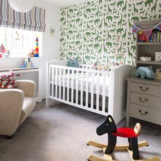 kids room with printed wall and white cabin bed
